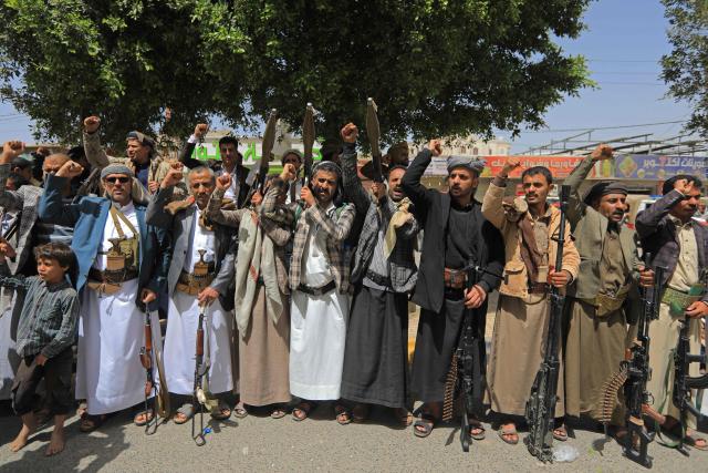 Yemeni demonstrators carrying weapons gather in Sanaa on April 2, 2026, during a protest against the Israeli parliament's approval of a new death penalty bill for Palestinians convicted of deadly attacks. The bill would make the death penalty the default punishment for Palestinians in the Israeli-occupied West Bank found guilty of intentionally carrying out deadly attacks deemed "acts of terrorism" by an Israeli military court. (Photo by Mohammed HUWAIS / AFP)