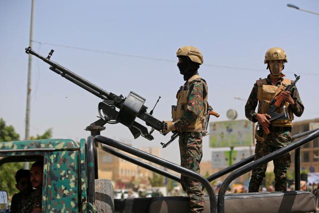 Yemeni security personnel keep vigil as supporters of Iran-backed Houthis, gather in Sanaa on April 2, 2026, during a protest against the Israeli parliament's approval of a new death penalty bill for Palestinians convicted of deadly attacks. The bill would make the death penalty the default punishment for Palestinians in the Israeli-occupied West Bank found guilty of intentionally carrying out deadly attacks deemed "acts of terrorism" by an Israeli military court. (Photo by Mohammed HUWAIS / AFP)