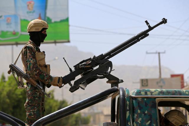 A Yemeni security personnel keeps vigil as supporters of Iran-backed Houthis, gather in Sanaa on April 2, 2026, during a protest against the Israeli parliament's approval of a new death penalty bill for Palestinians convicted of deadly attacks. The bill would make the death penalty the default punishment for Palestinians in the Israeli-occupied West Bank found guilty of intentionally carrying out deadly attacks deemed "acts of terrorism" by an Israeli military court. (Photo by Mohammed HUWAIS / AFP)