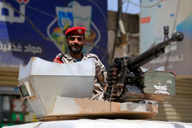 A Yemeni security personnel keeps vigil as supporters of Iran-backed Houthis, gather in Sanaa on April 2, 2026, during a protest against the Israeli parliament's approval of a new death penalty bill for Palestinians convicted of deadly attacks. The bill would make the death penalty the default punishment for Palestinians in the Israeli-occupied West Bank found guilty of intentionally carrying out deadly attacks deemed "acts of terrorism" by an Israeli military court. (Photo by Mohammed HUWAIS / AFP)