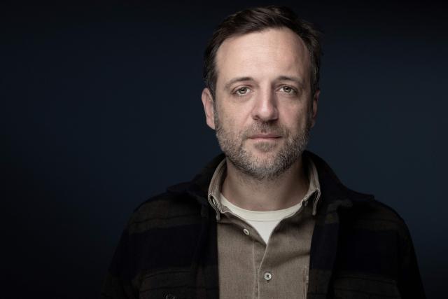 (FILES) French journalist, author and food critic Francois-Regis Gaudry poses during a photo session in Paris on November 8, 2022. Food journalist Francois-Regis Gaudry performs on stage until April 3, 2026 at the Theatre du Rond-Point in Paris, presenting a hybrid show exploring culinary memory and recounting his awakening to taste inherited from his Corsican grandmother. (Photo by JOEL SAGET / AFP)