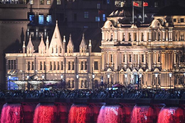 A view of the Bund promenade along the Huangpu river in Shanghai on April 2, 2026. (Photo by Hector RETAMAL / AFP)