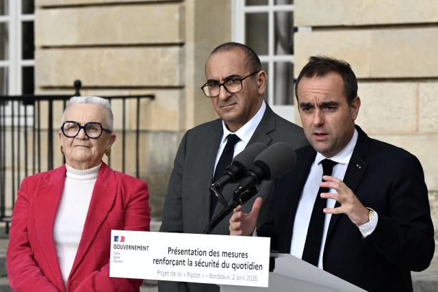 France's Prime Minister Sebastien Lecornu, flanked by France's Urbanity and Decentralisation Minister Francoise Gatel (L) and France's Interior Minister Laurent Nunez (C), delivers a press conference at the Bordeaux city hall to discuss public safety ahead of new policing legislation, in Bordeaux on April 2, 2026. (Photo by Philippe Lopez / POOL / AFP)