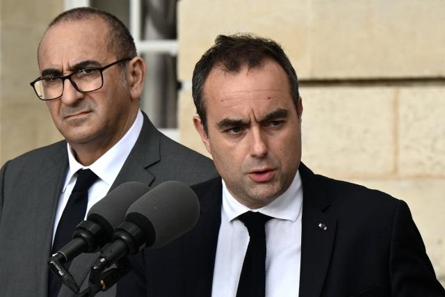France's Prime Minister Sebastien Lecornu, flanked by France's Interior Minister Laurent Nunez (L) delivers a press conference at the Bordeaux city hall to discuss public safety ahead of new policing legislation, in Bordeaux on April 2, 2026. (Photo by Philippe Lopez / POOL / AFP)