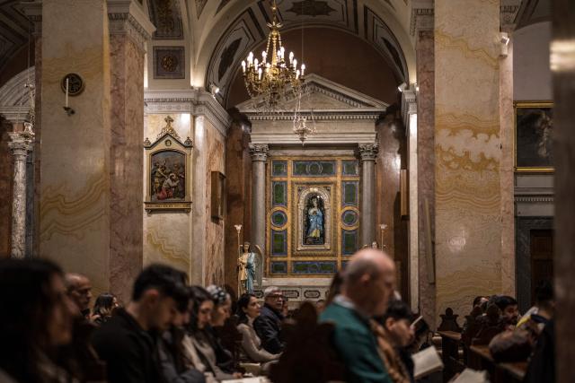 Congregants gather during the Maundy Thursday’s Washing of the Feet ceremony at the Christ the Saviour Church in the old city of Jerusalem on April 2, 2026. Holy sites in Jerusalem's old city have remained closed for security reasons since the outbreak of the Middle East war on February 28, when Israel and the US launched strikes on Iran. (Photo by MARCO LONGARI / AFP)