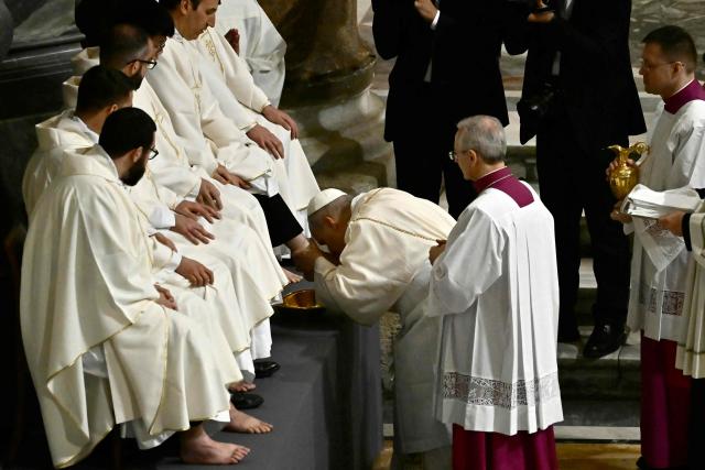 Pope Leo XIV performs the "Washing of the Feet" during the mass of the Lord’s Supper at St. John Lateran archbasilica in Rome, on April 2, 2026. (Photo by Filippo MONTEFORTE / AFP)