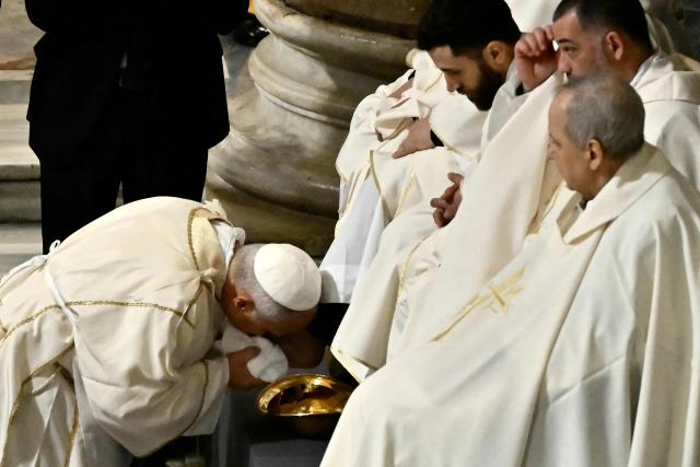 Pope Leo XIV performs the "Washing of the Feet" during the mass of the Lord’s Supper at St. John Lateran archbasilica in Rome, on April 2, 2026. (Photo by Filippo MONTEFORTE / AFP)