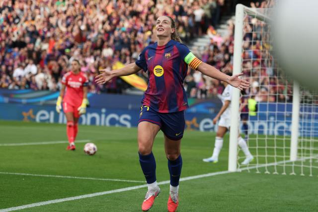 Barcelona's Spanish midfielder #11 Alexia Putellas celebrates scoring their first goal during the UEFA Women's Champions League quarter final second leg football match between FC Barcelona and Real Madrid CF at the Camp Nou stadium in Barcelona on April 2, 2026. (Photo by Lluis GENE / AFP)