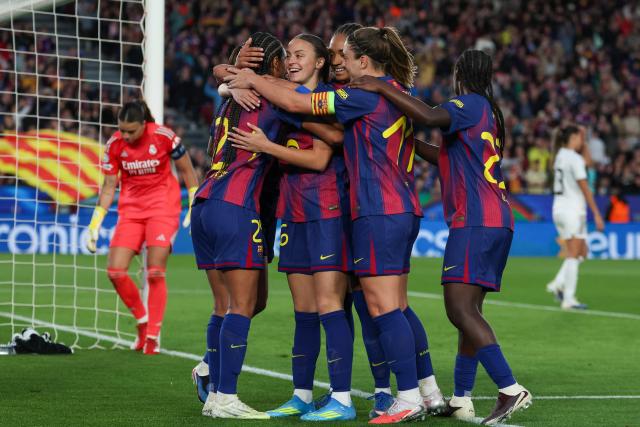 Barcelona's Dutch forward #24 Esmee Brugts (L) celebrates with teammates after scoring their sixth goal during the UEFA Women's Champions League quarter final second leg football match between FC Barcelona and Real Madrid CF at the Camp Nou stadium in Barcelona on April 2, 2026. (Photo by Lluis GENE / AFP)