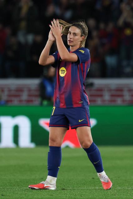 Barcelona's Spanish midfielder #11 Alexia Putellas applauds as she is substituted during the UEFA Women's Champions League quarter final second leg football match between FC Barcelona and Real Madrid CF at the Camp Nou stadium in Barcelona on April 2, 2026. (Photo by Lluis GENE / AFP)
