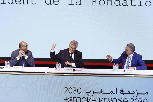 President of the Royal Moroccan Football Federation Fouzi Lekjaa (R), France’s junior Minister in charge of external trade Nicolas Forissier (C) and President of the French Football Federation Philippe Diallo (L) react during the first operational meeting of the bilateral support committee for the 2030 World Cup in Salй on April 2, 2026. (Photo by Abdel Majid BZIOUAT / AFP)