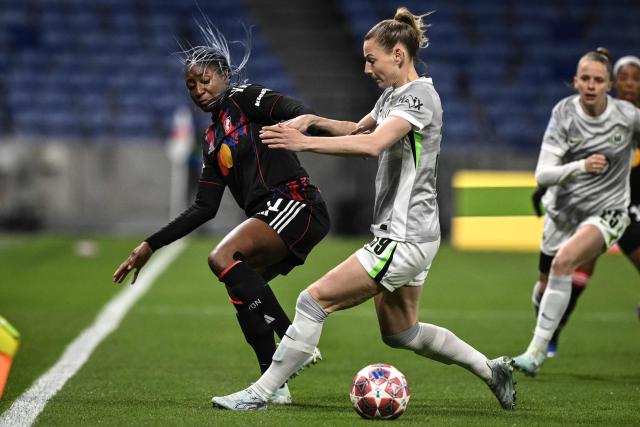 OL-Lyonnes's Lyon's French forward #11 Kadidiatou Diani (L) fights for the ball with VfL Wolfsburg's German defender #39 Sarai Linder (C) during the UEFA Women's Champions League quarter final second leg football match between OL Lyonnes (Lyon) and VfL Wolfsburg at the Groupama stadium in Decines-Charpieu, central-eastern France, on April 2, 2026. (Photo by JEFF PACHOUD / AFP)