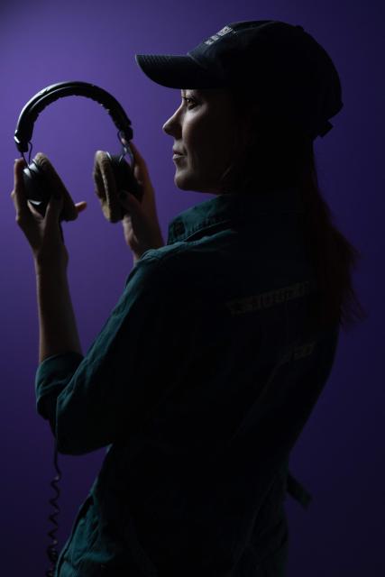 French producer-singer-songwriter of electronic music Cecile Leoge, aka DeLaurentis, poses in her music studio at home during a photo session in Paris, on March 31, 2026. (Photo by Joel Saget / AFP)