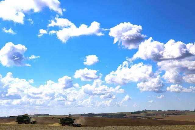 TOPSHOT - Harvest machines work in a soybean field in Cruz Alta, Rio Grande do Sul state, Brazil, on April 2, 2026. (Photo by SILVIO AVILA / AFP)