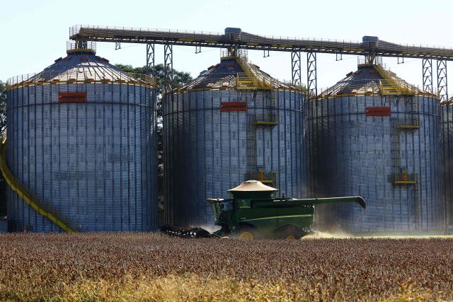 A harvest machine works in a soybean field in Cruz Alta, Rio Grande do Sul state, Brazil, on April 2, 2026. (Photo by SILVIO AVILA / AFP)