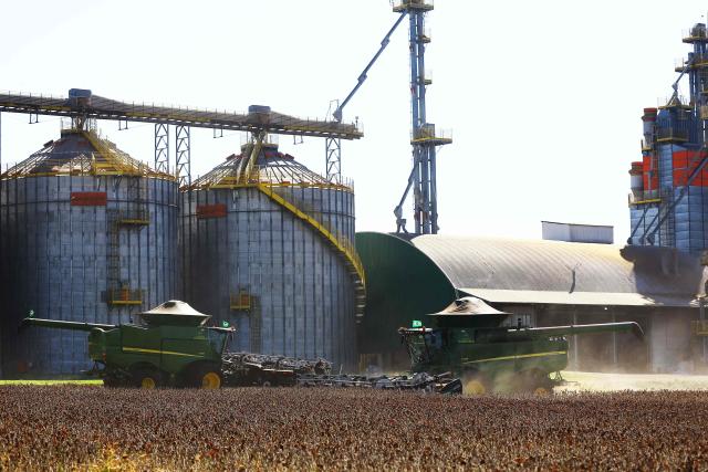Harvest machines work in a soybean field in Cruz Alta, Rio Grande do Sul state, Brazil, on April 2, 2026. (Photo by SILVIO AVILA / AFP)