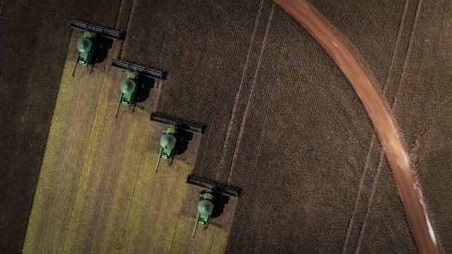 TOPSHOT - Aerial view of harvest machines working in a soybean field in Cruz Alta, Rio Grande do Sul state, Brazil, on April 2, 2026. (Photo by Silvio AVILA / AFP)