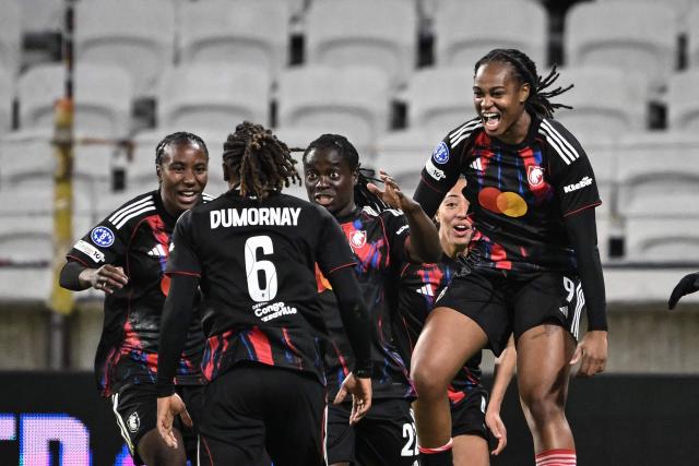 OL-Lyonnes' players celebrate a goal during the UEFA Women's Champions League quarter final second leg football match between OL Lyonnes (Lyon) and VfL Wolfsburg at the Groupama stadium in Decines-Charpieu, central-eastern France, on April 2, 2026. (Photo by JEFF PACHOUD / AFP)