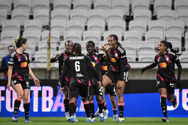 OL-Lyonnes' players celebrate a goal during the UEFA Women's Champions League quarter final second leg football match between OL Lyonnes (Lyon) and VfL Wolfsburg at the Groupama stadium in Decines-Charpieu, central-eastern France, on April 2, 2026. (Photo by JEFF PACHOUD / AFP)
