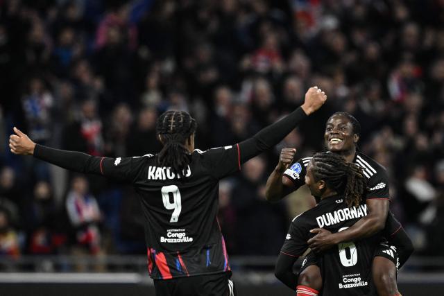 Lyon’s Malawi forward #22 Tabitha Chawinga (R) celebrates after scoring a goal during  the UEFA Women's Champions League quarter final second leg football match between OL Lyonnes (Lyon) and VfL Wolfsburg at the Groupama stadium in Decines-Charpieu, central-eastern France, on April 2, 2026. (Photo by JEFF PACHOUD / AFP)