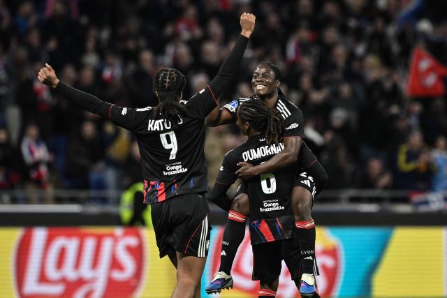 Lyon’s Malawi forward #22 Tabitha Chawinga (R) celebrates after scoring a goal during  the UEFA Women's Champions League quarter final second leg football match between OL Lyonnes (Lyon) and VfL Wolfsburg at the Groupama stadium in Decines-Charpieu, central-eastern France, on April 2, 2026. (Photo by JEFF PACHOUD / AFP)