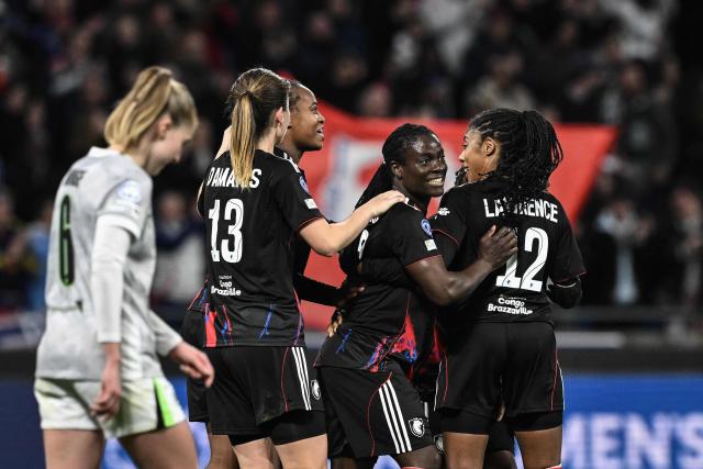 Lyon’s Malawi forward #22 Tabitha Chawinga (2nd R) celebrates after scoring a goal during  the UEFA Women's Champions League quarter final second leg football match between OL Lyonnes (Lyon) and VfL Wolfsburg at the Groupama stadium in Decines-Charpieu, central-eastern France, on April 2, 2026. (Photo by JEFF PACHOUD / AFP)