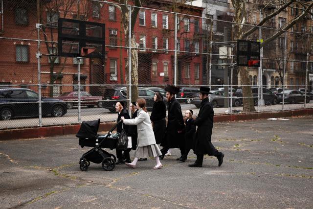 An Ultra-Orthodox Jewish family walks in a street of Williamsburg in the Brooklyn borough of New York during Passover (Pesach) on April 2, 2026. Pesach, which runs from April 1-9 this year, is a major eight-day Jewish holiday commemorating the biblical Exodus of the Israelites from Egyptian slavery. (Photo by CHARLY TRIBALLEAU / AFP)