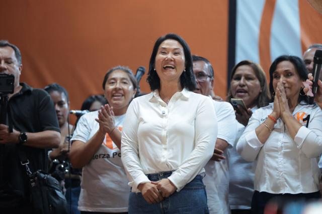 Peru's presidential candidate Keiko Fujimori (C), for the Fuerza Popular party, laughs during a campaign rally at the Peru-Korea Esplanade in the Ventanilla district, Peru on April 2, 2026. Peru will hold presidential elections on April 12. (Photo by Connie FRANCE / AFP)