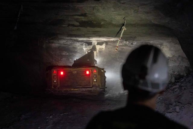 Miners use heavy machines to work more than 1,000 meters underground at the Polkowice–Sieroszowice copper and silver mine in southwestern Poland, owned by KGHM, the country's metallurgical giant, on March 25, 2026. Thousands of meters beneath the ground, amid suffocating heat, lies one of the keys to Poland's rumbling mining sector -- and the world economy. (Photo by Wojtek RADWANSKI / AFP)