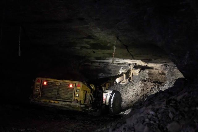 Miners use heavy machines to work more than 1,000 meters underground at the Polkowice–Sieroszowice copper and silver mine in southwestern Poland, owned by KGHM, the country's metallurgical giant, on March 25, 2026. Thousands of meters beneath the ground, amid suffocating heat, lies one of the keys to Poland's rumbling mining sector -- and the world economy. (Photo by Wojtek RADWANSKI / AFP)