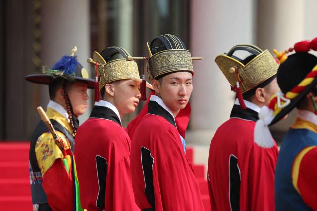 Members of the South Korean Presidential Guard of Honor participate in the official welcoming ceremony for French President Emmanuel Macron at the Blue House in Seoul on April 3, 2026. (Photo by Ludovic MARIN / AFP)