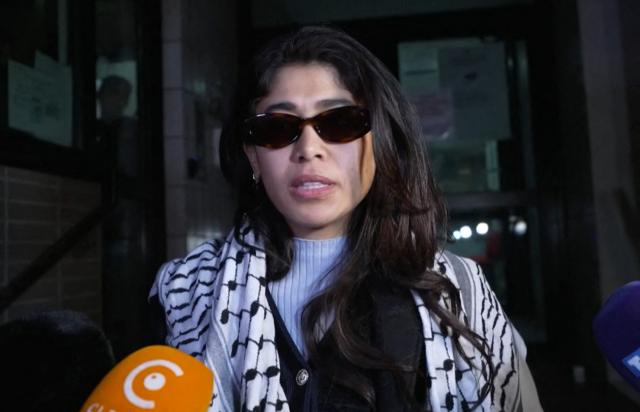 French-Palestinian member of the European Parliament Rima Hassan speaks with reporters after being released from police custody in Paris, France, on April 2, 2026. The elected official from La France Insoumise (LFI, radical left) was released from police custody on Thursday evening and has been summoned to appear in court on July 7, 2026 to stand trial on charges of glorification of terrorism "committed online," due to one of his posts on X, the Paris Public Prosecutor's Office announced. (Photo by Nassim GOMRI / AFP)