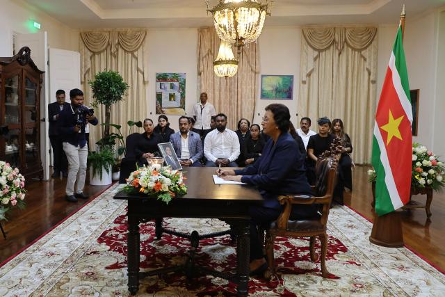 Suriname's President Jennifer Simons-Geerlings signs a condolence register for late former president Chandrikapersad Santokhi at the presidential palace in Paramaribo on April 2, 2026. Former Surinamese President Chan Santokhi, known for his investigation into the 1982 massacre of opposition members during the dictatorship of Desi Bouterse, has died at the age of 67, the government announced on March 30, 2026. Santokhi served as president of Suriname from 2020 to 2025, when he handed over power to opposition leader Jennifer Geerlings-Simons. (Photo by Ranu ABHELAKH / AFP)