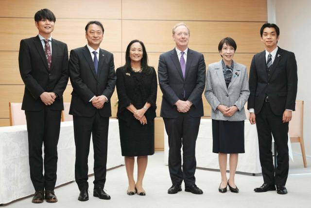 (L-R) SAKURA internet Inc President and CEO Kunihiro Tanaka, SoftBank Corp. President and CEO Junichi Miyakawa, Microsoft Japan President Miki Tsusaka, Microsoft's Vice Chair and President Brad Smith, Japan’s Prime Minister Sanae Takaichi, and Vice Minister of Economy, Trade and Industry Toshiro Ino, pose before their meeting at the Prime Minister’s Office in Tokyo on April 3, 2026. (Photo by Kazuhiro NOGI / POOL / AFP)