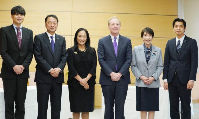(L-R) Sakura  internet Inc President and CEO Kunihiro Tanaka, SoftBank Corp. President and CEO Junichi Miyakawa, Microsoft Japan President Miki Tsusaka, Microsoft's Vice Chair and President Brad Smith, Japan’s Prime Minister Sanae Takaichi, and Vice Minister of Economy, Trade and Industry Toshiro Ino, pose before their meeting at the Prime Minister’s Office in Tokyo on April 3, 2026. (Photo by Kazuhiro NOGI / POOL / AFP)