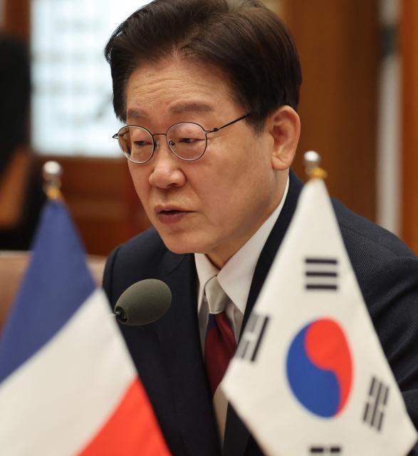 South Korean President Lee Jae Myung talks with French President Emmanuel Macron (not pictured) during a bilateral meeting in Seoul on April 3, 2026. (Photo by Ludovic MARIN / AFP)
