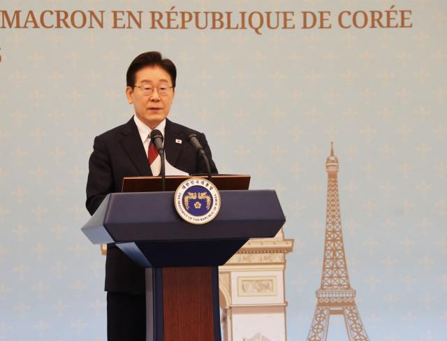 South Korean President Lee Jae-myung speaks during a joint press conference with French President Emmanuel Macron following their bilateral meeting in Seoul on April 3, 2026. (Photo by Ludovic MARIN / AFP)