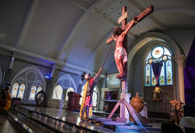 Indonesian Catholics reenact the crucifixion of Jesus Christ at the compound of St. Vincent A Paulo church in Surabaya, eastern Java island on April 3, 2026, as Christian devotees mark the holy week in Indonesia, a predominantly Muslim nation. (Photo by JUNI KRISWANTO / AFP)