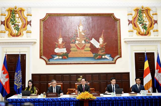 Cambodian justice minister Koeut Rith (C) speaks during a press conference at Minitry of Justice in Phnom Penh on April 3, 2026. Fraudsters running cyberscam operations in Cambodia could face life in prison after the Senate approved a new law on April 3, targeting criminals involved in the multibillion-dollar illicit industry. (Photo by TANG CHHIN Sothy / AFP)