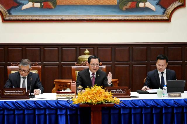 Cambodian justice minister Koeut Rith (C) speaks during a press conference at Minitry of Justice in Phnom Penh on April 3, 2026. Fraudsters running cyberscam operations in Cambodia could face life in prison after the Senate approved a new law on April 3, targeting criminals involved in the multibillion-dollar illicit industry. (Photo by TANG CHHIN Sothy / AFP)