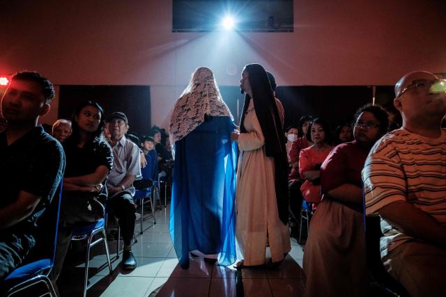 Catholics take part in a reenactment of the Passion of Christ on Good Friday at St. Bonaventura Church in Jakarta on April 3, 2026, as Christian devotees mark the Holy Week in Indonesia, a predominantly Muslim nation. (Photo by Yasuyoshi Chiba / AFP)