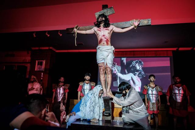 Catholics take part in a reenactment of the Passion of Christ on Good Friday at St. Bonaventura Church in Jakarta on April 3, 2026, as Christian devotees mark the Holy Week in Indonesia, a predominantly Muslim nation. (Photo by Yasuyoshi Chiba / AFP)