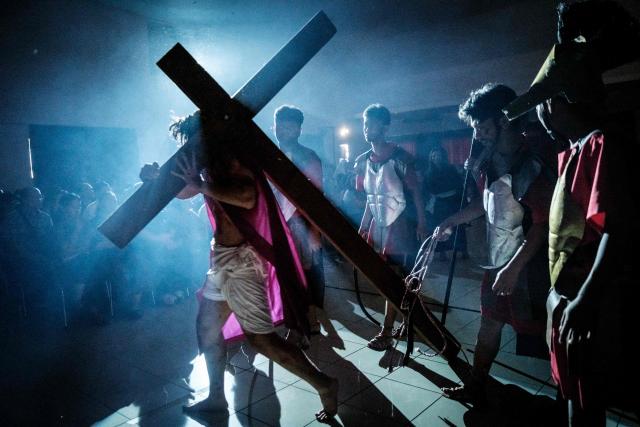 Catholics take part in a reenactment of the Passion of Christ on Good Friday at St. Bonaventura Church in Jakarta on April 3, 2026, as Christian devotees mark the Holy Week in Indonesia, a predominantly Muslim nation. (Photo by Yasuyoshi Chiba / AFP)