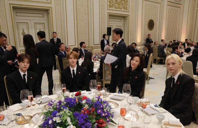 K-pop singers and artists attend a state lunch with French President Emmanuel Macron and South Korean President Lee Jae-myung (both not pictured), in Seoul on April 3, 2026. (Photo by Ludovic MARIN / AFP)