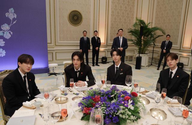 K-pop singers and artists attend a state lunch with French President Emmanuel Macron and South Korean President Lee Jae-myung (both not pictured), in Seoul on April 3, 2026. (Photo by Ludovic MARIN / AFP)