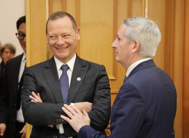 French press advisor Jean-Noel Ladois (R) and French diplomatic advisor Emmanuel Bonne attend a state lunch with French President Emmanuel Macron and South Korean President Lee Jae-myung (both not pictured), in Seoul on April 3, 2026. (Photo by Ludovic MARIN / AFP)