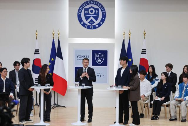 French President Emmanuel Macron speaks during a meeting with students at Yonsei University in Seoul on April 3, 2026. (Photo by Ludovic MARIN / AFP)