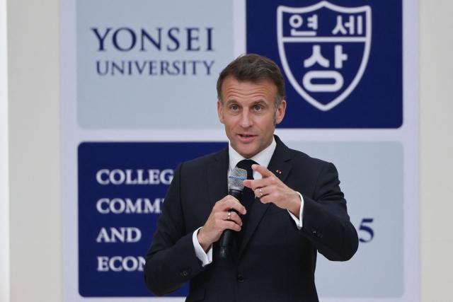 French President Emmanuel Macron speaks during a meeting with students at Yonsei University in Seoul on April 3, 2026. (Photo by Ludovic MARIN / AFP)