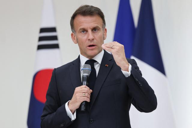 French President Emmanuel Macron speaks during a meeting with students at Yonsei University in Seoul on April 3, 2026. (Photo by Ludovic MARIN / AFP)