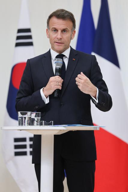 French President Emmanuel Macron speaks during a meeting with students at Yonsei University in Seoul on April 3, 2026. (Photo by Ludovic MARIN / AFP)